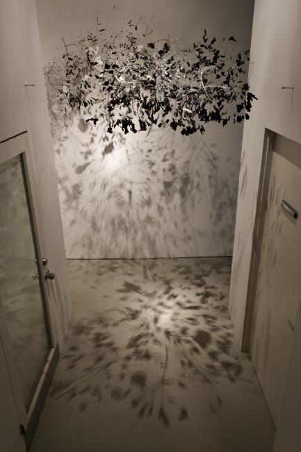 Digital image IRC.2012.05984 showing Garry Pyles's installation, There’s a black cloud/But, we make the weather/Shit it's raining, at the Mattress Factory, 2011.