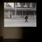 Photograph Depicting John Smith III, <em>The Girl Chewing Gum</em>, 1976 at the Mattress Factory