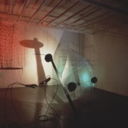 slide IRC.2012.02068 (old number: TIE.H-D001) showing Hanne Tierney's performance, Drama for Strings in Three Movements: Light, Sound, Gesture, at the Mattress Factory, 1988.