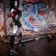 slide IRC.2012.01625 (old number: IUM.X-T001) showing a still from ium's filmed and screened performance, Tales from the Warehouse, at the Mattress Factory, 1999.