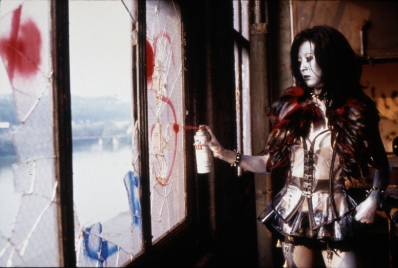 slide IRC.2012.01628 (old number: IUM.X-T004) showing a still from ium's filmed and screened performance, Tales from the Warehouse, at the Mattress Factory, 1999.