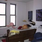 Digital image IRC.2013.01012 showing Jo-Anne Bates's installation, Sunday Mornin = Hats, Hats &amp; Mo Hats, at the Mattress Factory, 2003.