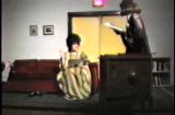 Digital image IRC.2013.00896 showing John Smith's video performance of David Sedaris's play, A Walk through Destiny's Plaything, at the Mattress Factory, 2002.