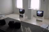 Digital image IRC.2013.00890 showing John Smith's video performance of David Sedaris's play, A Walk through Destiny's Plaything, at the Mattress Factory, 2002.