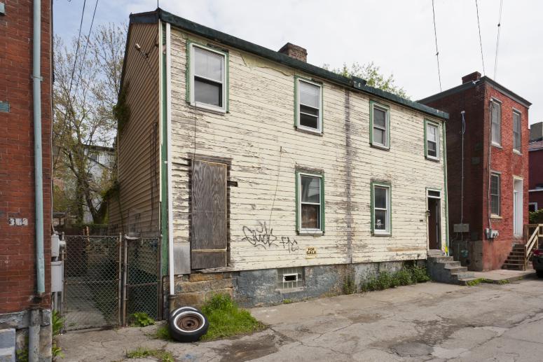 Digital image IRC.2012.05713 showing Seamus Nolan's installation, 310-312 Sampsonia Way, For Sale by Owner, Great Opportunity, at the Mattress Factory, 2011.