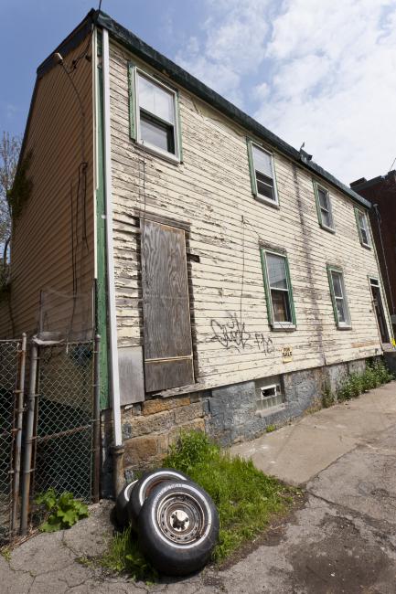 Digital image IRC.2012.05718 showing Seamus Nolan's installation, 310-312 Sampsonia Way, For Sale by Owner, Great Opportunity, at the Mattress Factory, 2011.