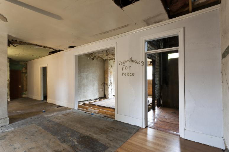 Digital image IRC.2012.05683 showing Seamus Nolan's installation, 310-312 Sampsonia Way, For Sale by Owner, Great Opportunity, at the Mattress Factory, 2011.