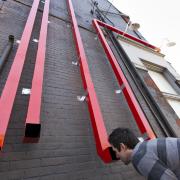 Digital image IRC.2012.04168 showing Dee Briggs's installation, Art You Can Get into...If You Have $12, at the Mattress Factory, 2012.