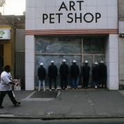 slide IRC.2012.00117 (old number: AUD.X-P005) showing Benôit Maubrey and Hans Peter Kuhn's public performances entitled Audio-Jackets in downtown Pittsburgh, Oakland, and Shadyside, 1986.