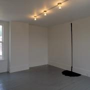 slide IRC.2012.00098 (old number: ANA.W-OP001) showing William Anastasi's One Gallon High Gloss Industrial Enamel, Poured on an Incision installation at the Mattress Factory, 1989.