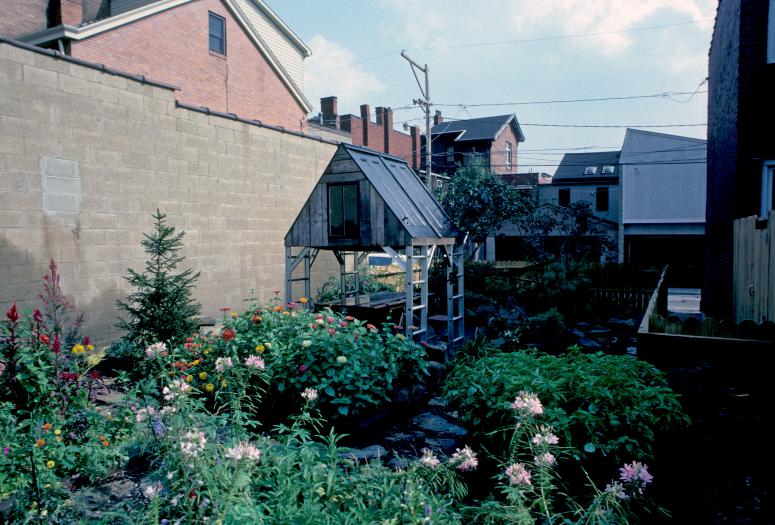 slide IRC.2012.00069 (old number: ACC.V-M006) showing Vito Acconci's garden installation, Making Shelter: House of Used Parts, at the Mattress Factory, 1986.