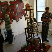 Digital image IRC.2013.03610 showing Vanessa German's performance, Random Black Girl, in front of her installation, Fantastic, at the Mattress Factory, 2005.