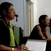 Digital image IRC.2013.03100 showing Toi Derricotte's performance, Landscape of the Body - Poems, and Allan Wexler's permanent installation, Bed-Sitting Room for Artist in Residence, at the Mattress Factory, 2005.